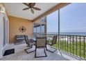 Oceanfront balcony with seating for four at 1900 Gulf N Dr # 4, Bradenton Beach, FL 34217