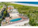 Stunning rooftop pool and patio overlooking the beach at 648 Beach Rd, Sarasota, FL 34242