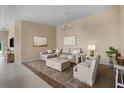 Spacious living room with L-shaped sofa and stylish coffee table at 7637 Quinto Dr, Sarasota, FL 34238