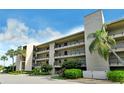 Condo building exterior showcasing its architecture and landscaping at 4540 Gulf Of Mexico Dr # Ph1, Longboat Key, FL 34228