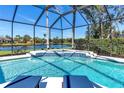 Inviting screened pool with tiled water feature and lounge chairs at 10622 Cheval Pl, Lakewood Ranch, FL 34202