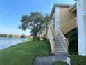 Condo building steps from a tranquil lake, offering waterfront access at 1050 Villagio Cir # 206, Sarasota, FL 34237