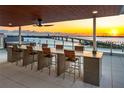 Rooftop terrace with city views, hot tub, and seating at 111 Golden Gate Pt # 201, Sarasota, FL 34236