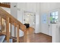 Bright entryway with wood stairs and view of an office at 3125 57Th Avenue E Cir, Bradenton, FL 34203