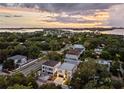 Elevated view of a modern home in a residential neighborhood near the water at 3464 Camino Real, Sarasota, FL 34239