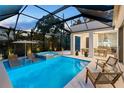 Luxury pool and spa with covered patio and outdoor kitchen at 3464 Camino Real, Sarasota, FL 34239