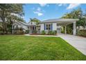 Single-story home with attached garage and landscaped front yard at 4532 Shark Dr, Bradenton, FL 34208