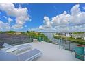 Relaxing rooftop terrace with water views and lounge chairs at 4607 5Th Ne Ave, Bradenton, FL 34208