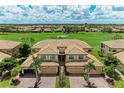 Scenic aerial view of a residential area featuring well-maintained homes and lush green spaces at 6708 Grand Estuary Trl # 104, Bradenton, FL 34212