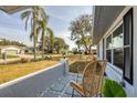 Relaxing front porch with patio furniture and lush landscaping at 2806 67Th W St, Bradenton, FL 34209