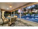 Relaxing screened patio overlooking a refreshing pool and lush landscape at 6414 Glen Abbey Ln, Bradenton, FL 34202