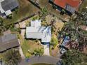 Aerial view of a single-story house featuring a long driveway and well-maintained landscaping at 2522 Fruit Tree Dr, Sarasota, FL 34239