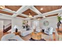 Living room featuring hardwood floors, a wood ceiling, and comfortable seating at 3101 Riverview Blvd, Bradenton, FL 34205