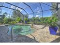 Inviting screened-in pool and spa area at 1362 Hedgewood Cir, North Port, FL 34288