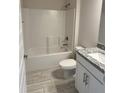 Bathroom featuring a shower-tub combination, granite vanity top, and modern fixtures at 2628 Averland Loop, North Port, FL 34287