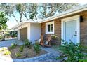 Inviting front entrance with light blue door and wood-like siding at 4616 Leeta Ln, Sarasota, FL 34234