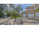 Landscaped grounds showcasing a brick driveway and a portion of the house's exterior at 5309 Hidden Harbor Rd, Sarasota, FL 34242