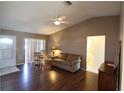 Living room with wood floors, sliding glass doors, and bathroom access at 4105 33Rd Avenue W Dr # 4105, Bradenton, FL 34205