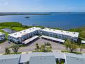 Aerial view of condo complex near waterfront with parking at 4720 Independence Dr # 4720, Bradenton, FL 34210