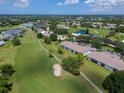 Aerial of community highlighting its location on a golf course with ponds at 6904 Drewrys Blf # 810, Bradenton, FL 34203