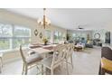 Inviting dining area open to living room filled with natural light from large windows at 7820 34Th W Ave # 102, Bradenton, FL 34209