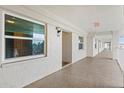 Condo hallway with unit 306 entrance and bright windows at 7201 29Th Avenue W Dr # 306, Bradenton, FL 34209