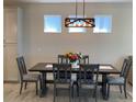 Dining room with a dark wood table and gray chairs at 1045 Crosswind Ave, Sarasota, FL 34240