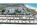 Aerial view of community near beach with pool at 1048 W Peppertree Ln # 118B, Sarasota, FL 34242