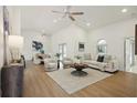 Bright living room with hardwood floors and comfy seating at 5296 White Sand Ne Cir, St Petersburg, FL 33703