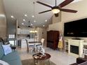 Bright living room features a fireplace and a view to the kitchen at 7225 Cedar Hollow Cir # 20-201, Bradenton, FL 34203