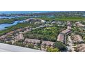 Aerial view of a large community of villas near the water at 1676 Starling Dr # 202, Sarasota, FL 34231