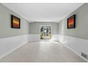 Bright living room with tile floors and sliding glass doors at 5310 26Th W St # 2703, Bradenton, FL 34207