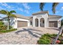 Beautiful home with a three-car garage and paver driveway at 333 Bocelli Dr, Nokomis, FL 34275