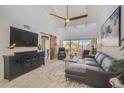 Bright living room featuring water views and stylish decor at 1555 Tarpon Center Dr # 202, Venice, FL 34285