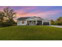 Single-story house with a large grassy yard at 2129 Lorraine Dr, Port Charlotte, FL 33953