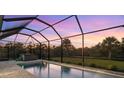Relaxing pool and spa area with sunset views at 2129 Lorraine Dr, Port Charlotte, FL 33953
