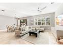 Bright and airy living room with a dining area and access to a patio at 655 Resolute St, Nokomis, FL 34275