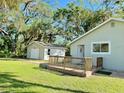 View of the home's backyard, showing patio and detached garage at 1127 41St St, Sarasota, FL 34234