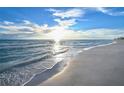 Scenic beachfront view with calm ocean waves at 535 Sanctuary Dr # A202, Longboat Key, FL 34228