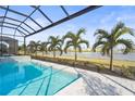 Enclosed pool and spa with lake view at 8332 Sea Glass Ct, Sarasota, FL 34240