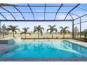 Enclosed pool and spa with lake view at 8332 Sea Glass Ct, Sarasota, FL 34240