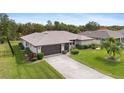 Single-story home with a large backyard and a paved driveway at 1478 Navigator Rd, Punta Gorda, FL 33983