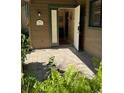 Front entry with tiled flooring, open door, and welcoming sign at 919 Sunridge Dr # 919, Sarasota, FL 34234