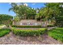 Mira Lago community entrance sign with lush landscaping at 4028 Mira Lago Dr, Sarasota, FL 34238