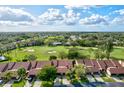 Aerial view of community, featuring homes, golf course, and pool at 6241 Timberlake Dr # D7, Sarasota, FL 34243