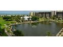 Aerial of resort community with pond and fountain at 1095 Gulf Of Mexico Dr # 502, Longboat Key, FL 34228