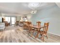 Light and airy dining area with wood table and chairs at 14459 River Beach Dr # 112, Port Charlotte, FL 33953