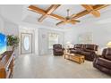 Bright living room featuring a view to the kitchen and front entrance at 1565 Piedmont Rd, Venice, FL 34293