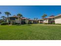 Attractive condo building with lush green lawn at 4234 Gulf Of Mexico Dr # Y2, Longboat Key, FL 34228