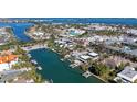 Waterfront home's aerial view shows private dock and desirable location near the city at 515 S Washington Dr, Sarasota, FL 34236